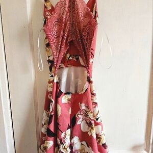 A mini dress. It runs in small. The colors are pink,beige white.